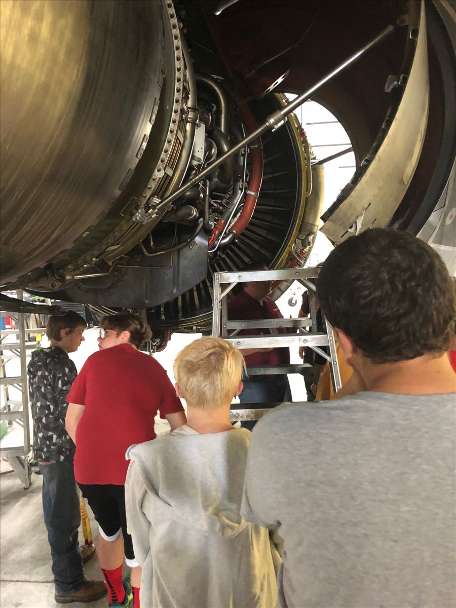 Students check out airplane engines at Kalitta