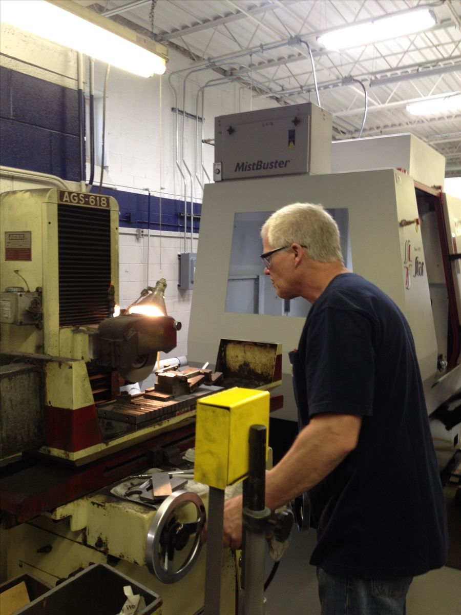Trainee Michael Oberleas runs Surface Grinder