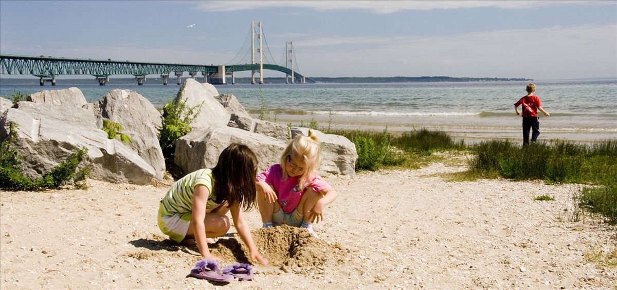 Playing on the beach in Mackinaw